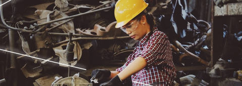 Mechanic wearing safety equipment and working in a workshop
